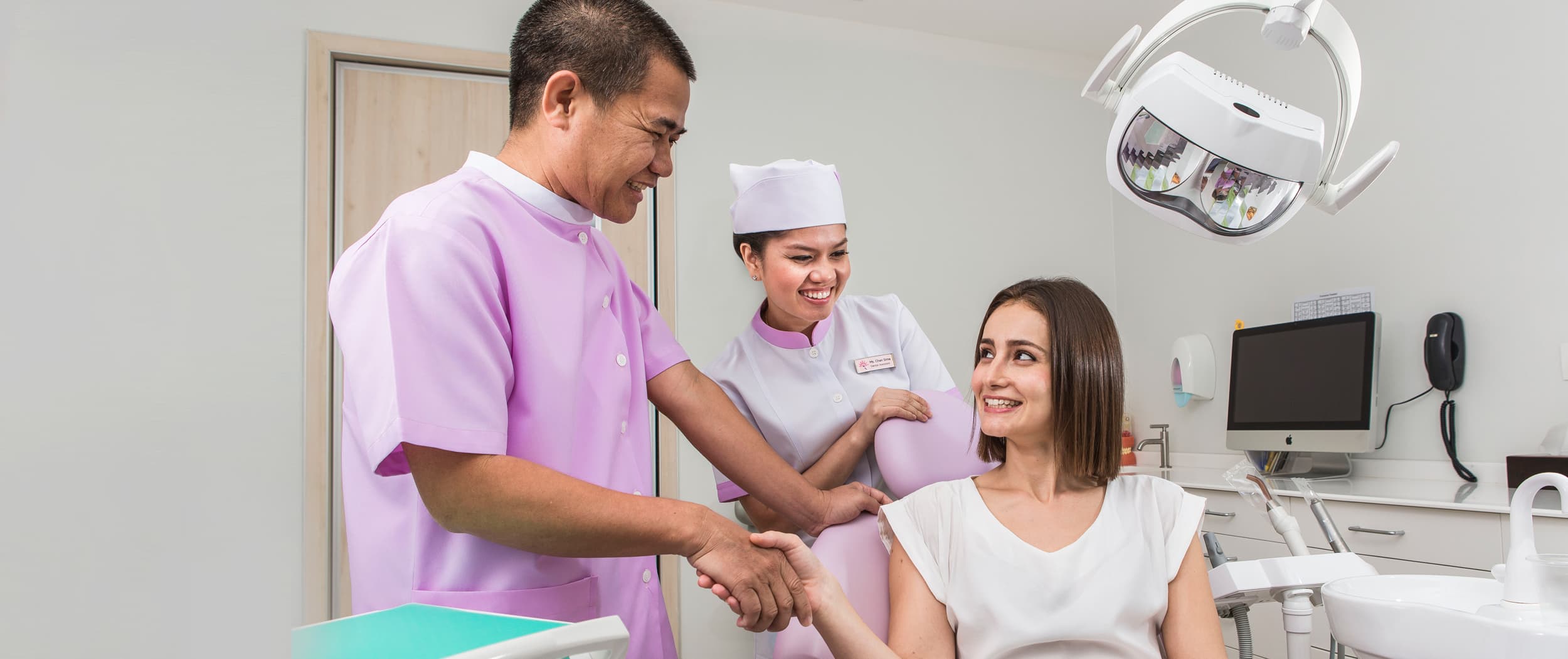 Roomchang dental team welcoming an international patient